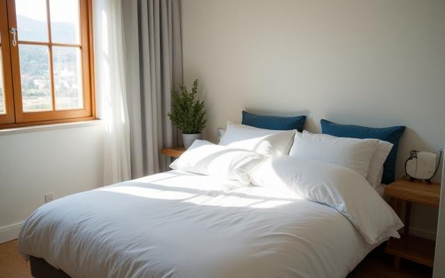 Stylish, modern rental apartment bedroom freshly cleaned and prepared for guests